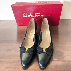 Salvatore Ferragamo pumps with gold-tone and bows
